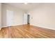 Large bedroom with hardwood floors, neutral paint, and a double door closet at 2704 Loring Nw Rd, Kennesaw, GA 30152