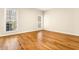 Bedroom with hardwood floors, two windows, and white crown molding at 2704 Loring Nw Rd, Kennesaw, GA 30152