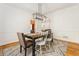 Dining area with a dark wood table, six chairs, and a patterned rug at 2704 Loring Nw Rd, Kennesaw, GA 30152