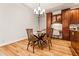 Kitchen nook with a glass-top table, wood chairs, and a built-in desk area at 2704 Loring Nw Rd, Kennesaw, GA 30152