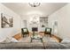 Bright living room featuring a fireplace, hardwood floors, and a vaulted ceiling at 2704 Loring Nw Rd, Kennesaw, GA 30152