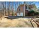 Rear view of the home with an attached garage at 2704 Loring Nw Rd, Kennesaw, GA 30152