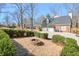 Cozy backyard featuring a stone firepit and meticulously maintained landscaping at 4679 Newell Dr, Marietta, GA 30062