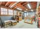 Unfinished basement with work tables, storage, and natural light, perfect for a workshop at 4679 Newell Dr, Marietta, GA 30062