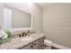 This bathroom features granite countertops, a decorative mirror, and a stylish design at 4679 Newell Dr, Marietta, GA 30062