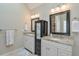 Bathroom with double vanity sinks, granite countertop, and framed mirrors at 4679 Newell Dr, Marietta, GA 30062