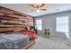 Comfortable bedroom with wood-paneled accent wall and a cozy bed at 4679 Newell Dr, Marietta, GA 30062