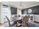 Bright dining room with a wooden table, six chairs, modern chandelier, and hardwood floors at 4679 Newell Dr, Marietta, GA 30062