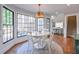 Dining room with a table and chairs, large windows, and hardwood flooring at 4679 Newell Dr, Marietta, GA 30062