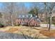 Elevated view of a brick home, showcasing its architectural design and surrounding landscape at 4679 Newell Dr, Marietta, GA 30062