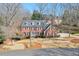 Brick home from an elevated viewpoint highlighting the landscaped yard and driveway at 4679 Newell Dr, Marietta, GA 30062