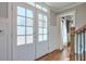 Bright foyer featuring hardwood floors, white trim, and a view into the living space at 4679 Newell Dr, Marietta, GA 30062