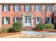 Close-up of the home's entrance, featuring a classic door and manicured bushes at 4679 Newell Dr, Marietta, GA 30062