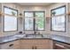 The kitchen features granite countertops and a corner window overlooking the yard at 4679 Newell Dr, Marietta, GA 30062