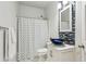 Stylish bathroom featuring a vessel sink, blue tile accents, shower, and modern fixtures at 569 Alexander Farms Sw Vw, Marietta, GA 30064