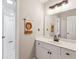 Bathroom featuring a vanity with modern fixtures and decorative lion wall art at 569 Alexander Farms Sw Vw, Marietta, GA 30064