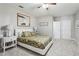 Cozy bedroom featuring a queen bed with leafy bedding, soft carpet, and double-door closet at 569 Alexander Farms Sw Vw, Marietta, GA 30064