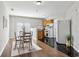 Dining area leading to a functional kitchen with modern appliances and ample natural light at 569 Alexander Farms Sw Vw, Marietta, GA 30064