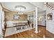 Spacious dining room with hardwood floors, wainscoting, chandelier lighting, and adjacent living spaces at 569 Alexander Farms Sw Vw, Marietta, GA 30064