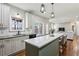 Kitchen island with bar seating open to living area at 569 Alexander Farms Sw Vw, Marietta, GA 30064