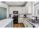 Kitchen featuring granite countertops, stainless steel appliances, and a pantry door at 569 Alexander Farms Sw Vw, Marietta, GA 30064