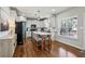 Kitchen featuring an island with seating, stainless steel appliances, and a pantry at 569 Alexander Farms Sw Vw, Marietta, GA 30064