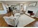 Living room with fireplace and hardwood floors, open to the kitchen at 569 Alexander Farms Sw Vw, Marietta, GA 30064