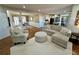 Open-concept living room with hardwood floors leading to dining area at 569 Alexander Farms Sw Vw, Marietta, GA 30064