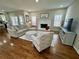 Bright living room with a fireplace, hardwood floors, and ample natural light at 569 Alexander Farms Sw Vw, Marietta, GA 30064