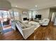 Living room featuring hardwood floors, a fireplace, and access to a deck at 569 Alexander Farms Sw Vw, Marietta, GA 30064