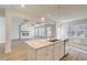 A kitchen island offers a view into a living area centered on a fireplace at 90 Barge Ln, Covington, GA 30016