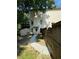 Backyard view of home with rock walkway and privacy fence at 1896 Lake Ridge Ter, Lawrenceville, GA 30043