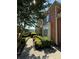 Brick home with manicured landscaping, charming walkway, and mature shade tree at 1896 Lake Ridge Ter, Lawrenceville, GA 30043