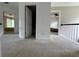 Upstairs hallway featuring carpet, neutral colors, and access to bedrooms at 1896 Lake Ridge Ter, Lawrenceville, GA 30043