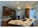 Kitchen boasts granite counters, wood cabinets, and modern stainless steel appliances at 1896 Lake Ridge Ter, Lawrenceville, GA 30043
