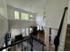 Open-concept living area with soaring ceilings, large windows, and hardwood floors at 1896 Lake Ridge Ter, Lawrenceville, GA 30043