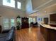 Bright and airy living area with hardwood floors, open to the kitchen and dining area at 1896 Lake Ridge Ter, Lawrenceville, GA 30043