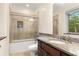 Well-appointed bathroom with granite countertops, a shower with glass doors and marble tile accents at 2146 Greensward Ne Dr, Atlanta, GA 30345