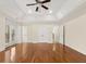 Large bedroom featuring hardwood floors, tray ceiling and double doors to a balcony at 2146 Greensward Ne Dr, Atlanta, GA 30345