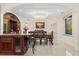 Bright dining area with marble floors, wine cooler, and a decorative chandelier at 2146 Greensward Ne Dr, Atlanta, GA 30345