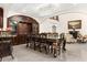 Elegant dining room with a large chandelier, grand table setting, and seamless connection to the living area at 2146 Greensward Ne Dr, Atlanta, GA 30345