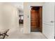 Interior elevator with wood paneling, marble floor and adjacent kitchen area with chairs and counter at 2146 Greensward Ne Dr, Atlanta, GA 30345