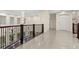 Upstairs hallway with decorative railing overlooking the foyer at 2146 Greensward Ne Dr, Atlanta, GA 30345