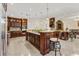 Large kitchen with custom cabinetry, large island with bar seating and marble countertops at 2146 Greensward Ne Dr, Atlanta, GA 30345