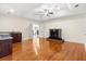 Cozy living room with hardwood floors, fireplace, and a wet bar at 2146 Greensward Ne Dr, Atlanta, GA 30345