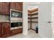 Walk-in pantry featuring ample shelving, providing excellent storage solutions alongside modern kitchen appliances at 2146 Greensward Ne Dr, Atlanta, GA 30345