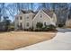 Stately home with a manicured lawn, mature trees, and a welcoming entrance at 2986 Sedgewick Pl, Marietta, GA 30062