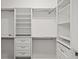 A spacious walk-in closet with custom shelving, drawers, and rods for organized storage at 4206 Townsend Ln, Atlanta, GA 30346