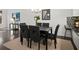 Formal dining area with dark wood floors, stylish seating, and an open layout at 4206 Townsend Ln, Atlanta, GA 30346