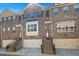 Beautiful brick townhome with a garage and a well-maintained lawn at 4206 Townsend Ln, Atlanta, GA 30346